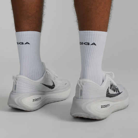 GIGA Socks in white three quarter back view with shoes