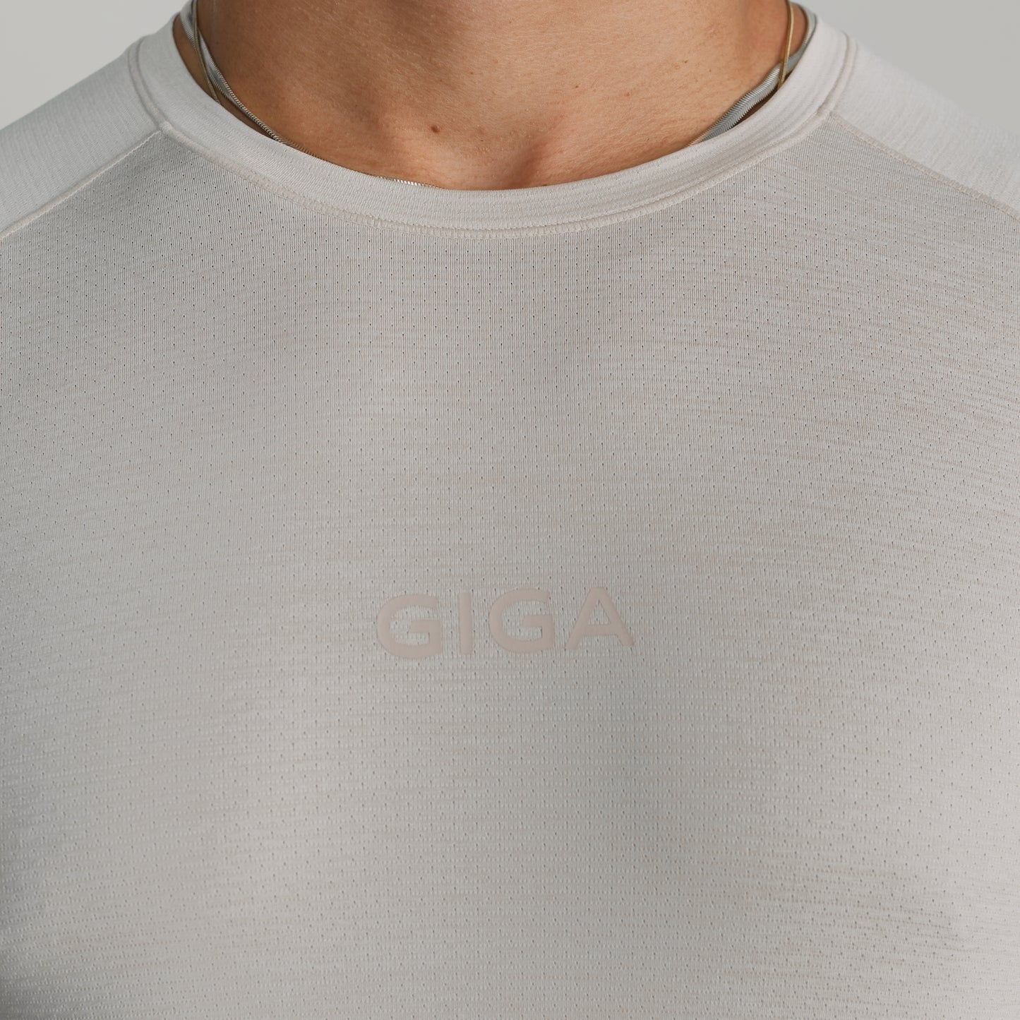 Close-up of GIGA Base Tee white fabric showing texture and neckline